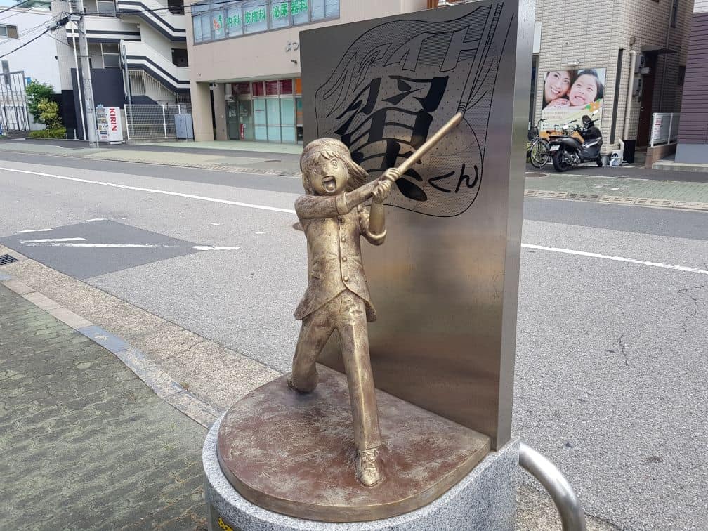 The Famous Captain Tsubasa Bronze Statue in Japan: Sanae Nakazawa holding a flag